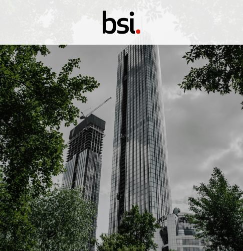 BSI cover bsi cover picture showing a skyscraper with trees surrounding it. Up top is the BSI logo on a white rectangle